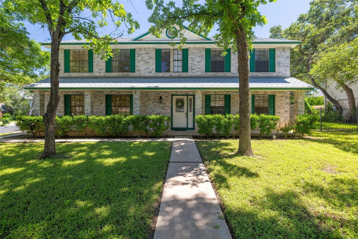Wonderful corner lot with side-entry garage & covered front porch across the entire front!