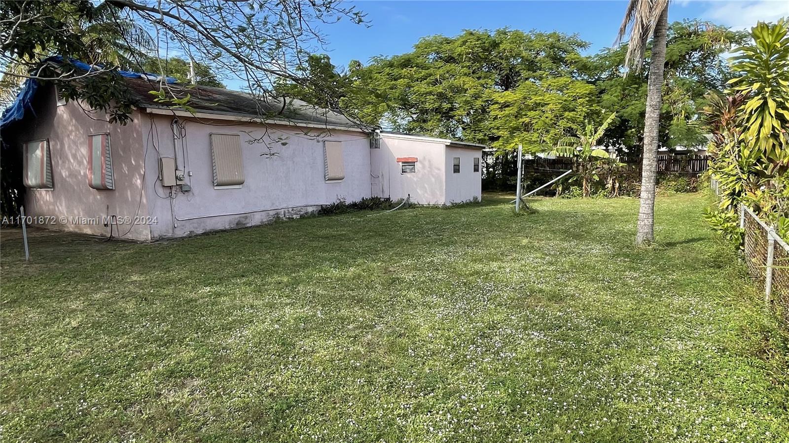 a backyard of a house with lots of green space