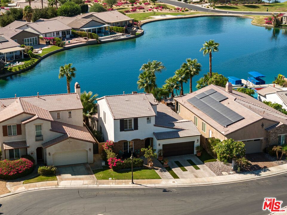 an aerial view of a house with a lake view