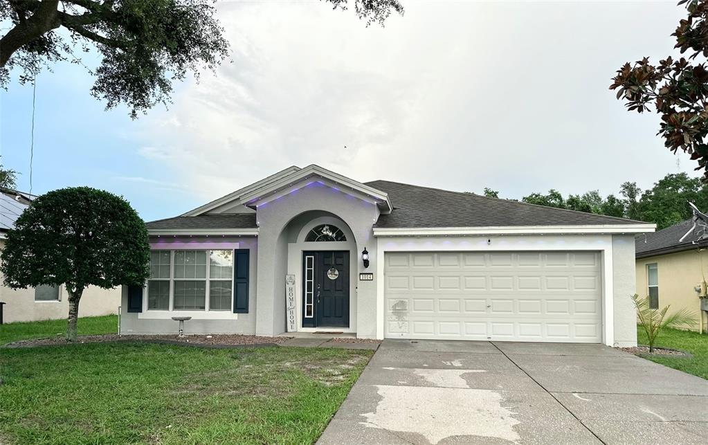 front view of a house with a garden