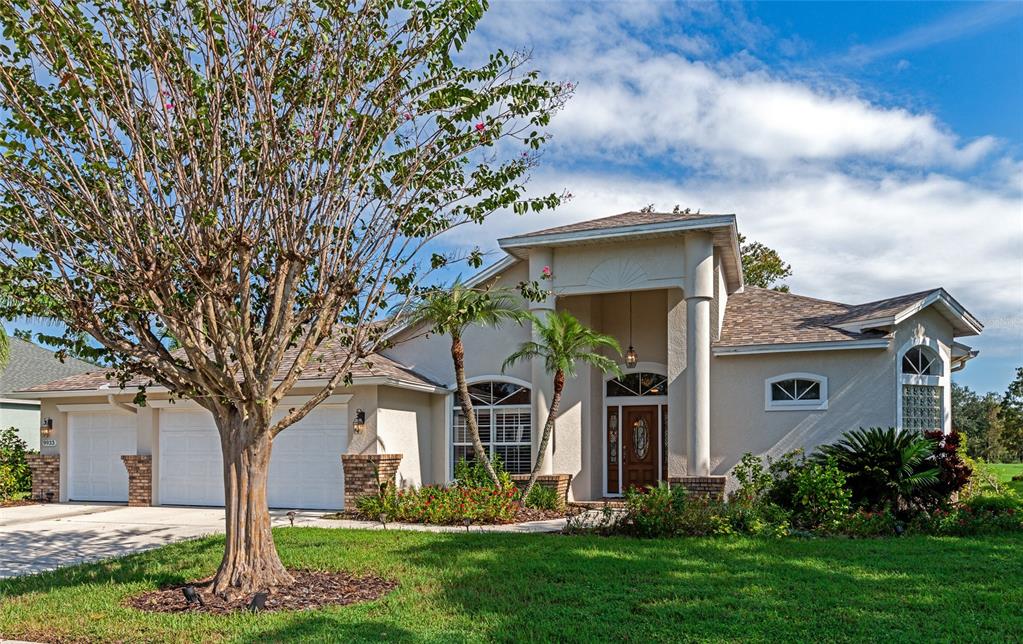 a front view of a house with garden