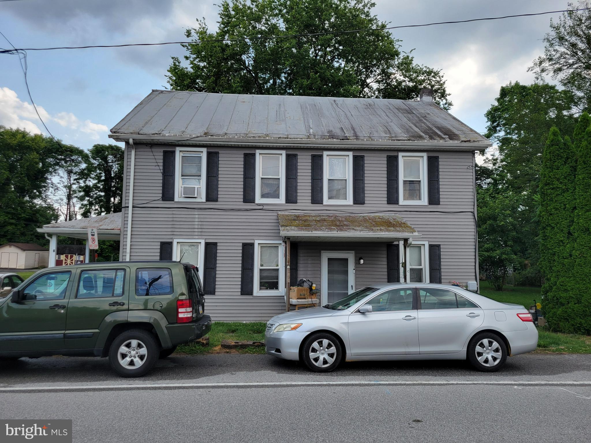 a car parked in front of a house