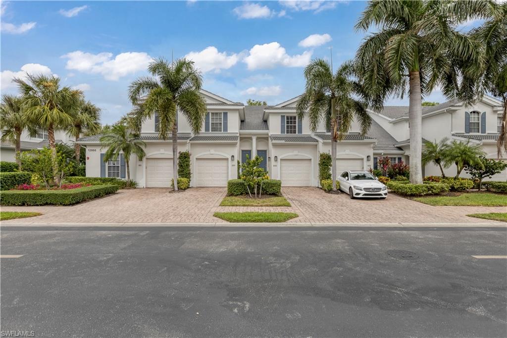 View of property with a garage