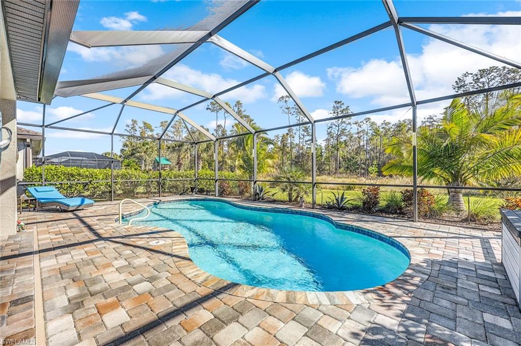 a view of a swimming pool with a yard