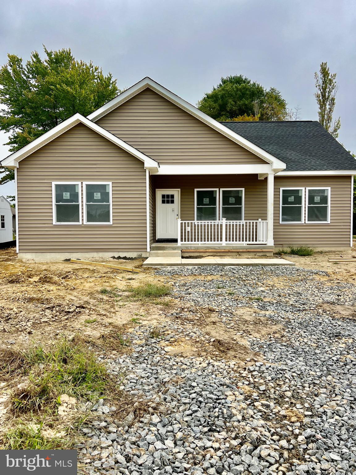 front view of a house with a yard