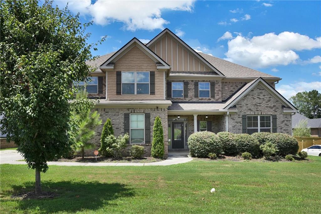 a front view of a house with a yard