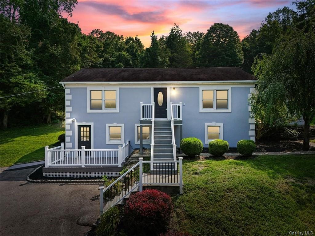 View of front of home with a yard