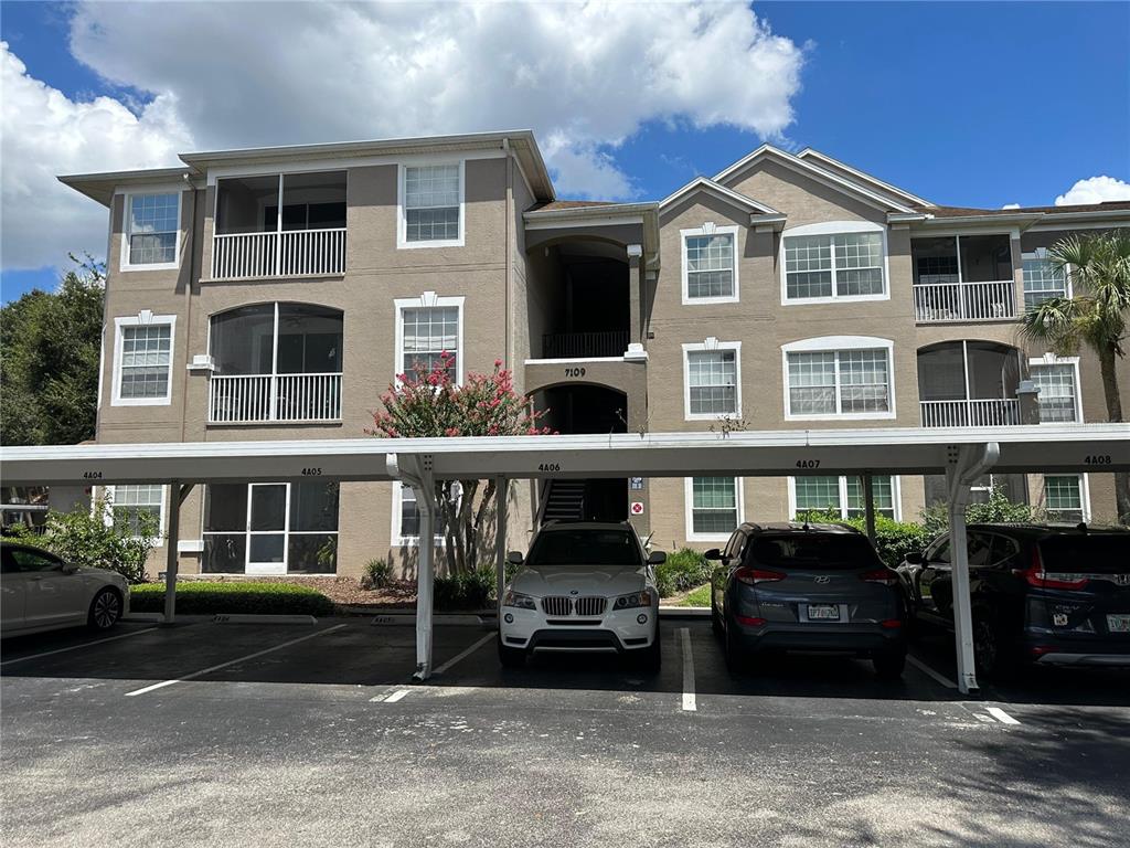 a front view of a building with parking space