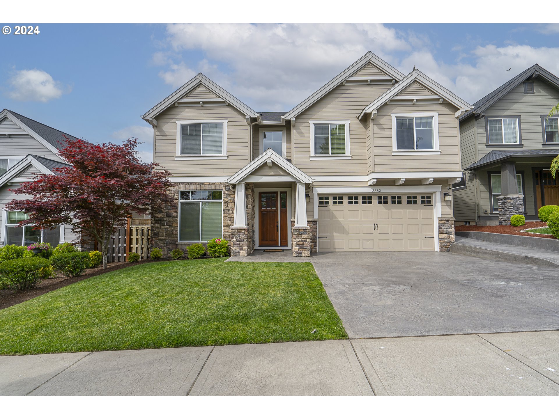 front view of a house with a yard