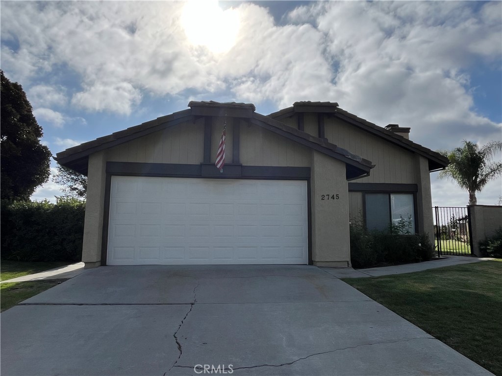 a house with yard in front of it