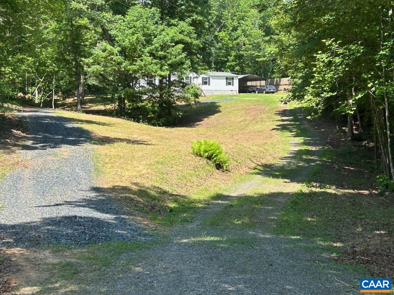 a front view of a house with a yard and a garage