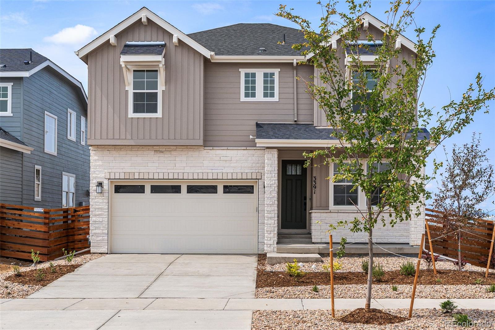 a front view of a house with a garage