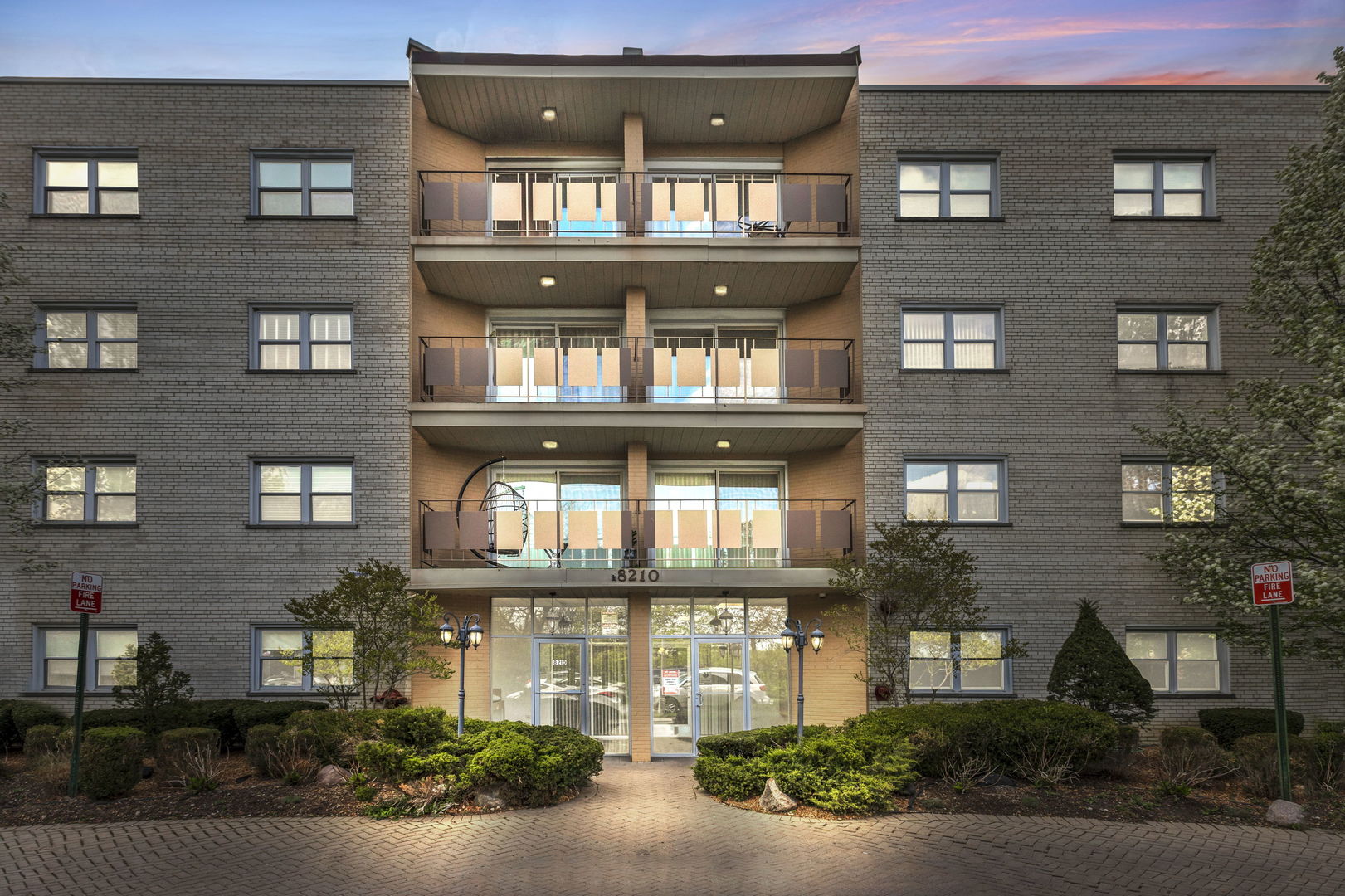 a front view of a building with many windows