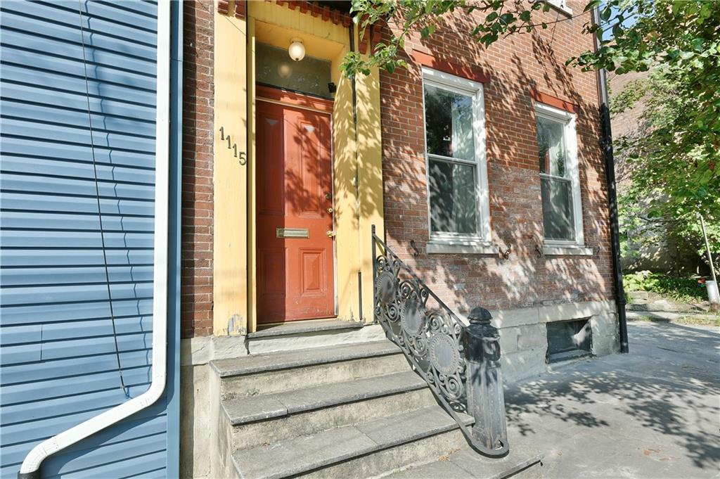 a view of entryway with brick walls