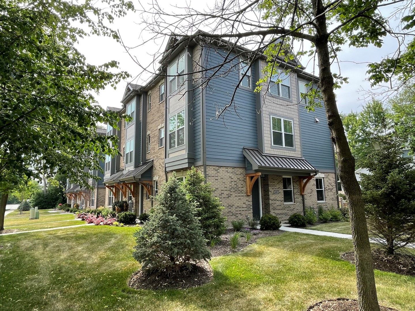 front view of a house with a yard