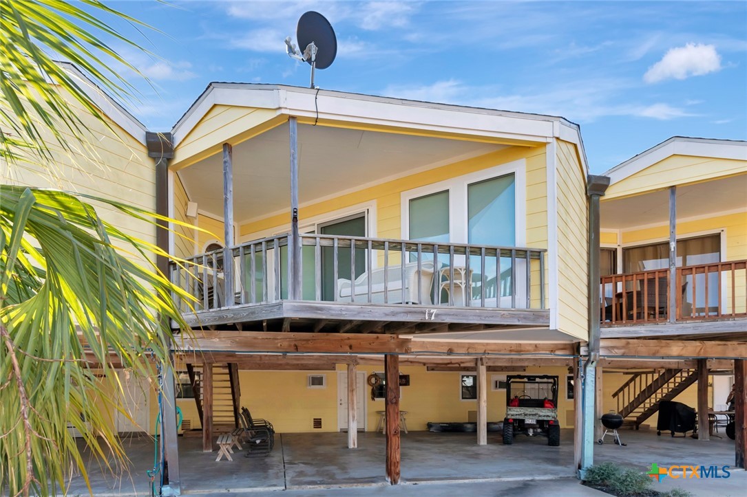 a roof deck with a table and chairs