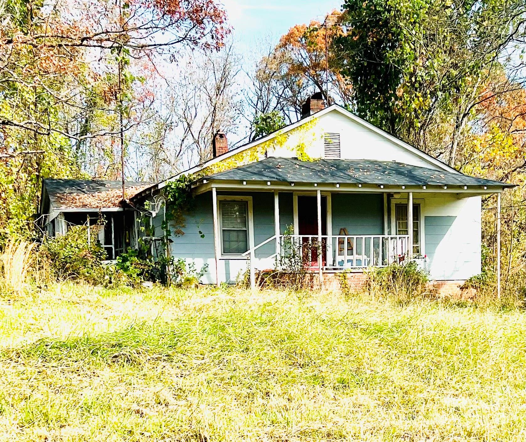 a front view of a house having yard and seating space