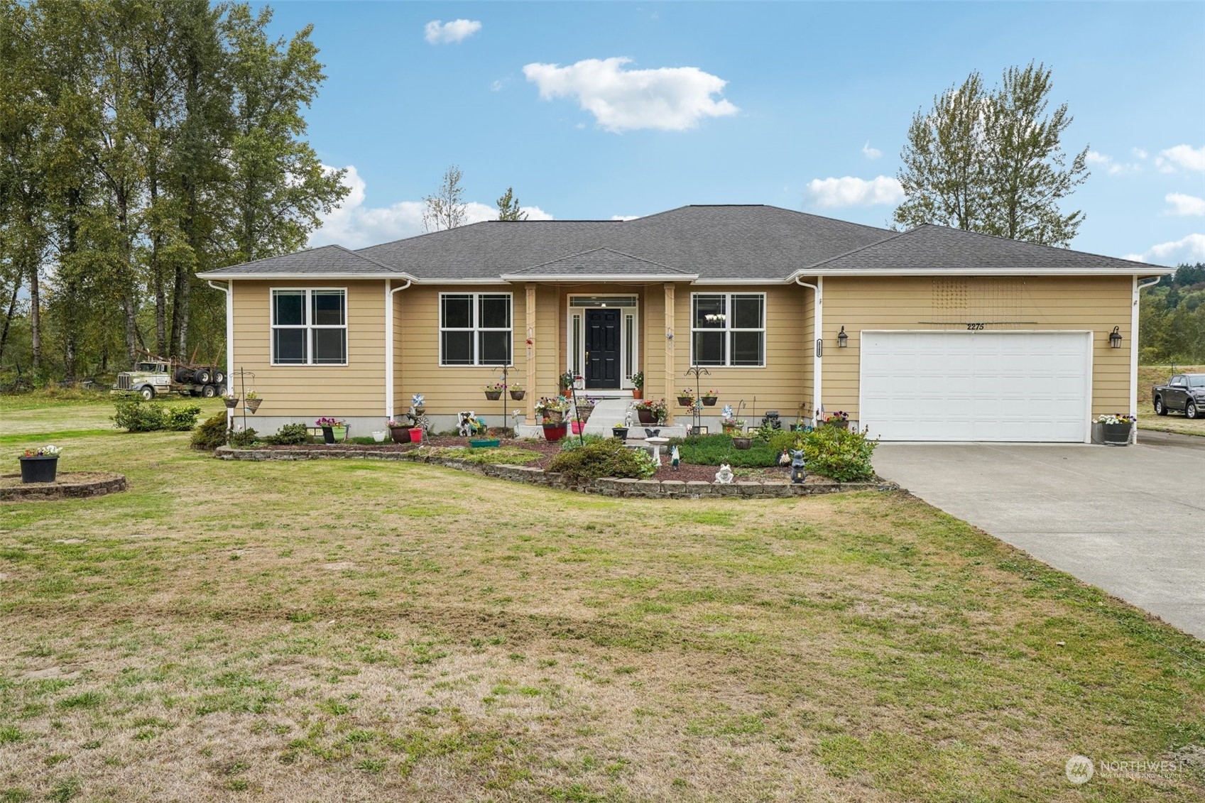 a front view of a house with garden