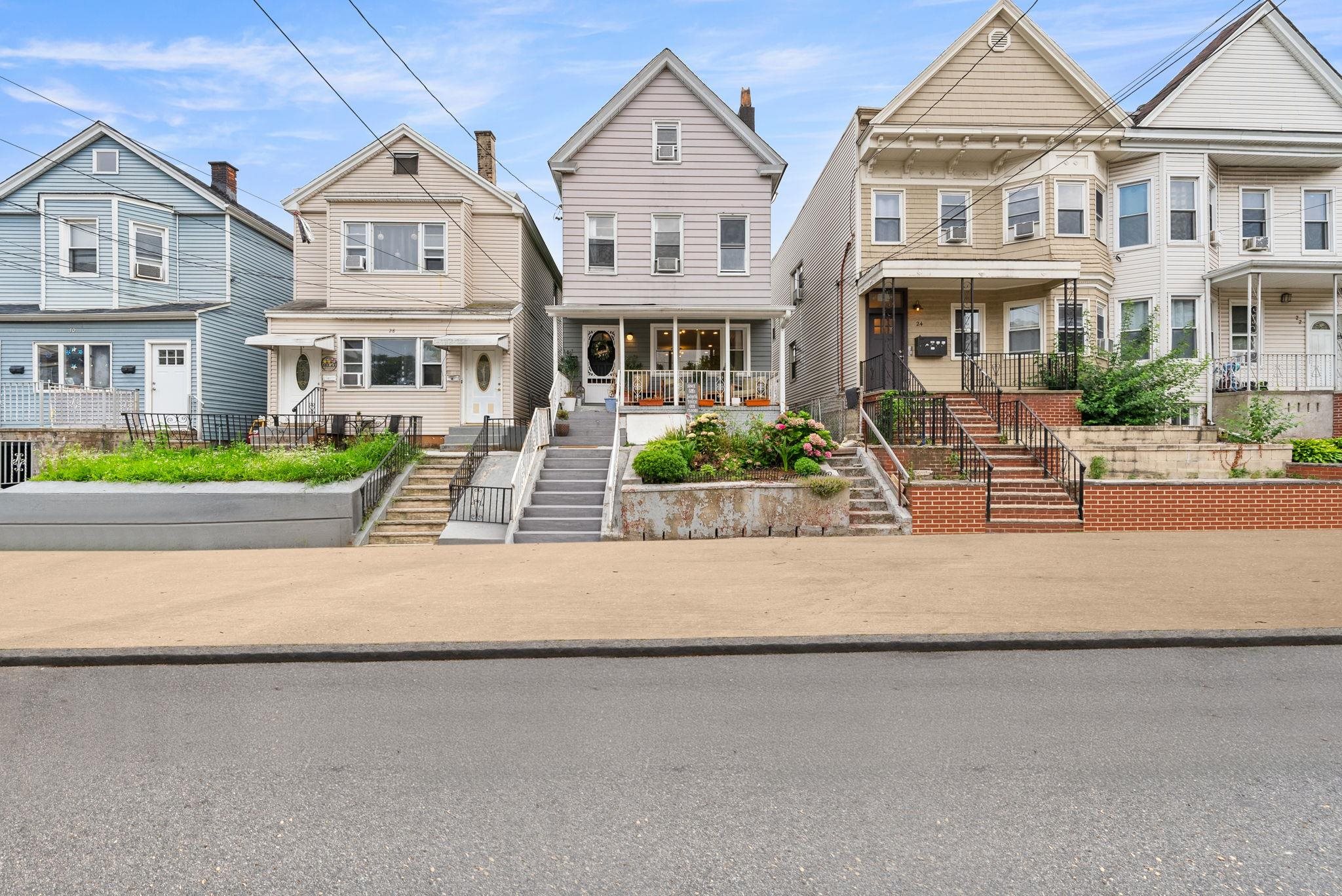 front view of a house with a small yard