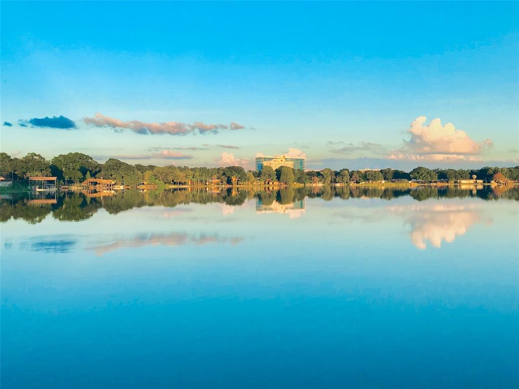 a view of a lake with houses in the back