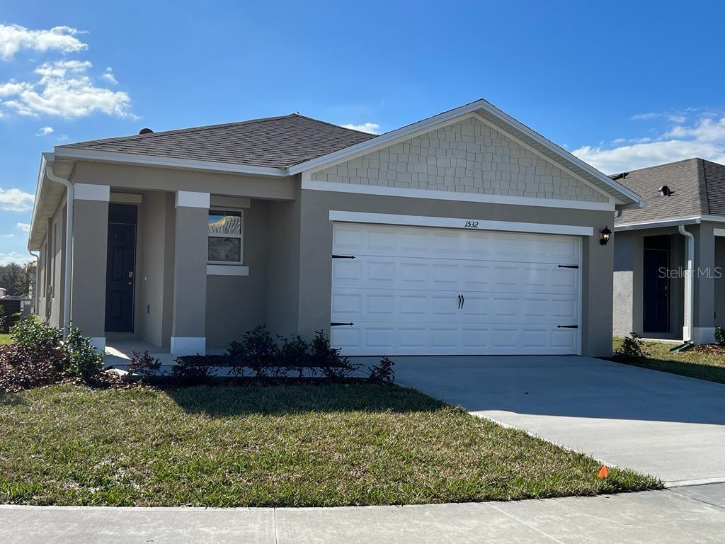 a front view of house with yard