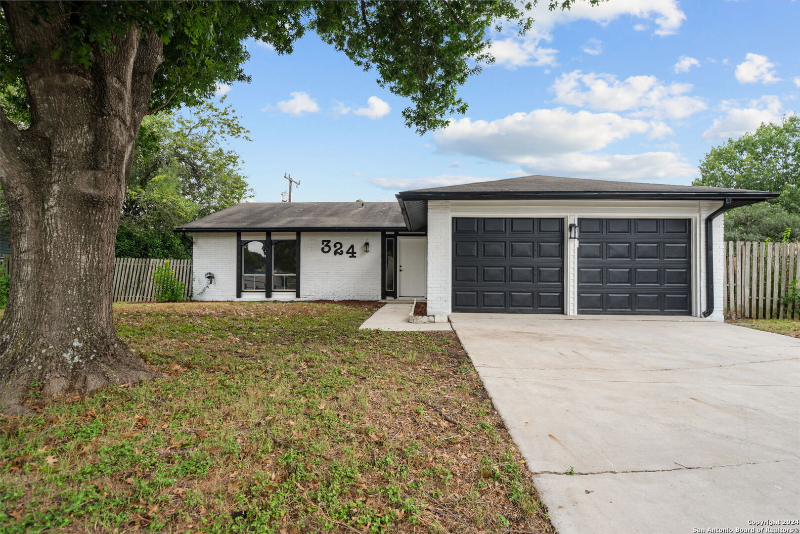 front view of a house with a yard