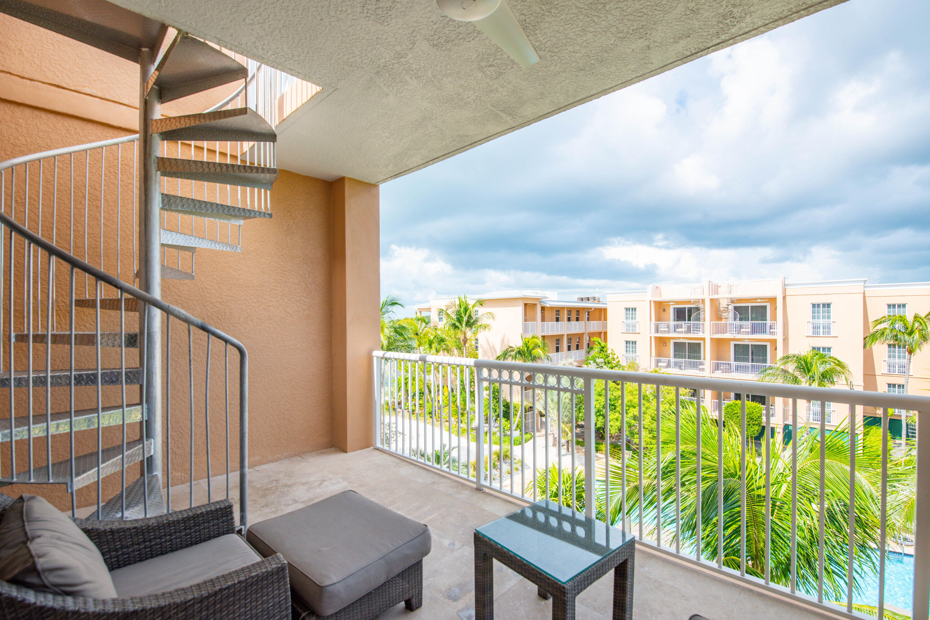 a view of a living room and balcony