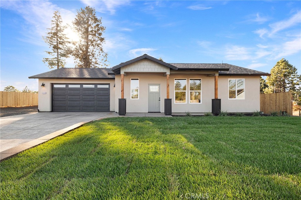 front view of a house with a yard