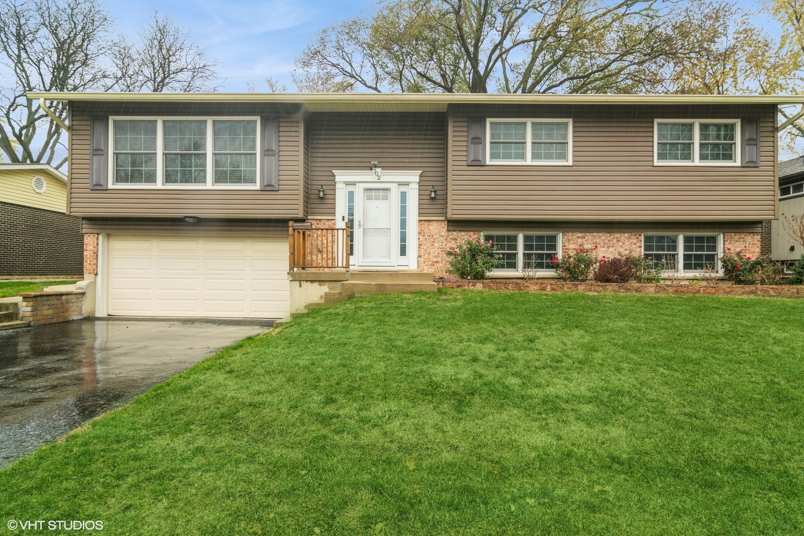 a front view of a house with garden