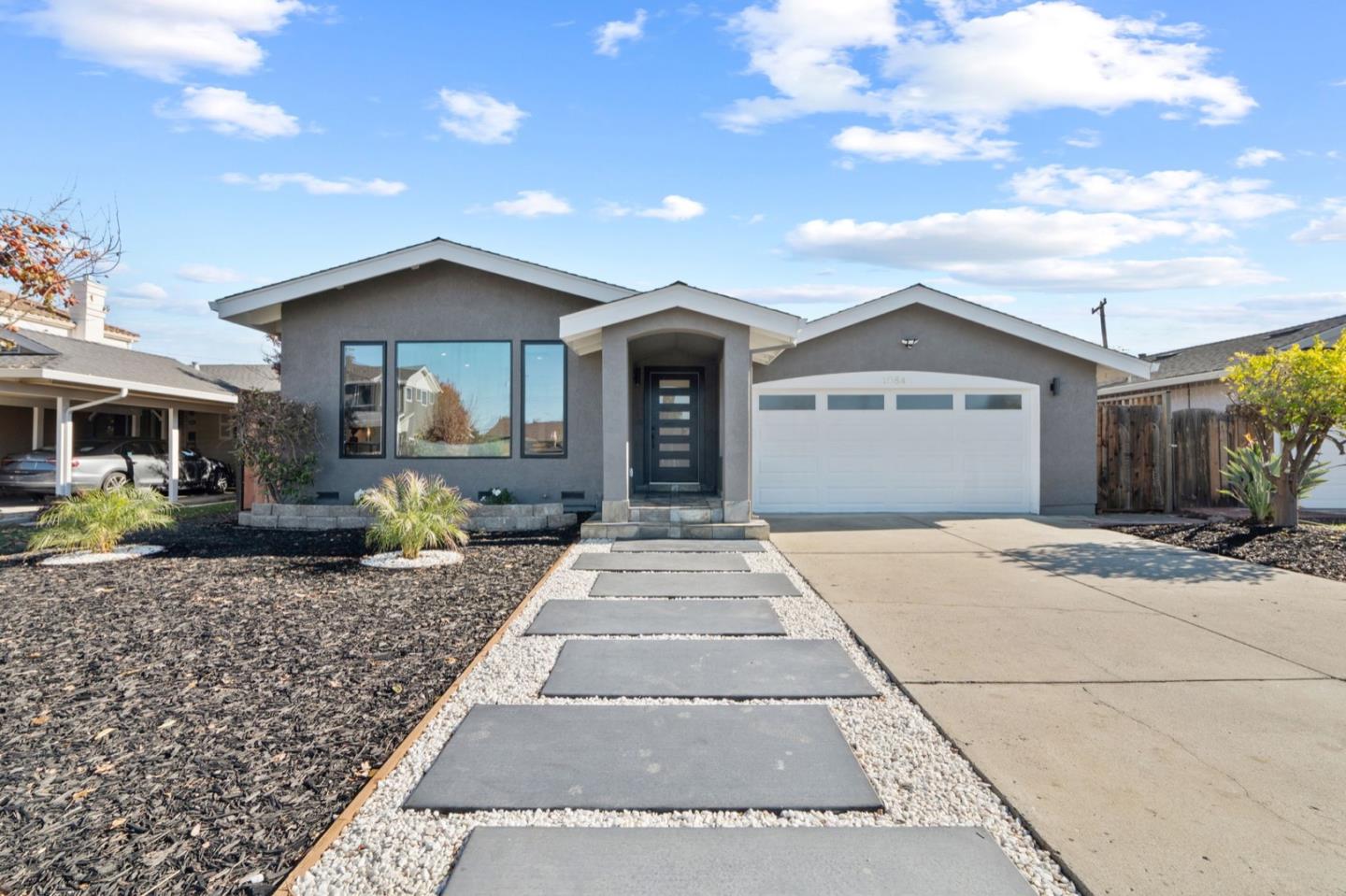 a front view of a house with yard