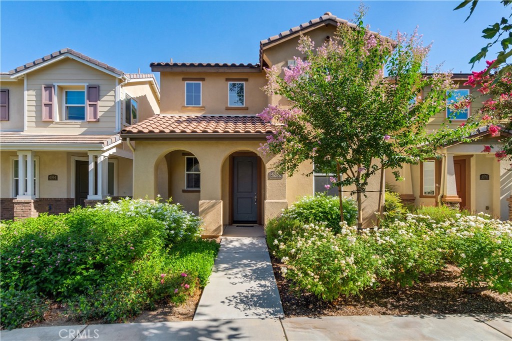 front view of a house with a garden