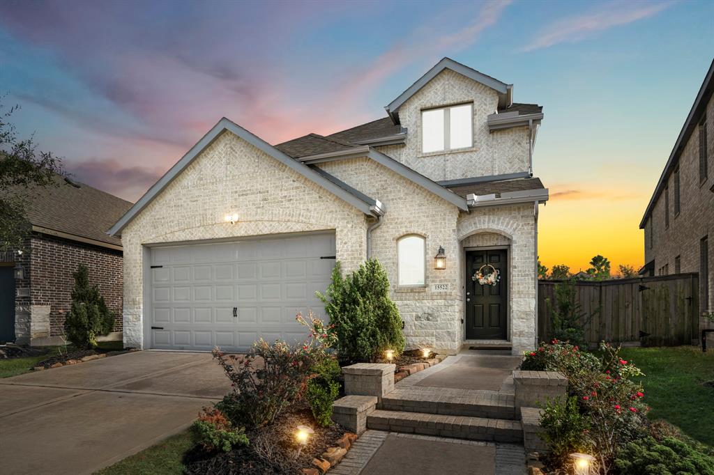 Welcome to 15522 Bosque Valley Court in Bridgeland's Parkland Village with amazing curb appeal. A beautiful brick facade with a neutral color scheme welcomes you home.