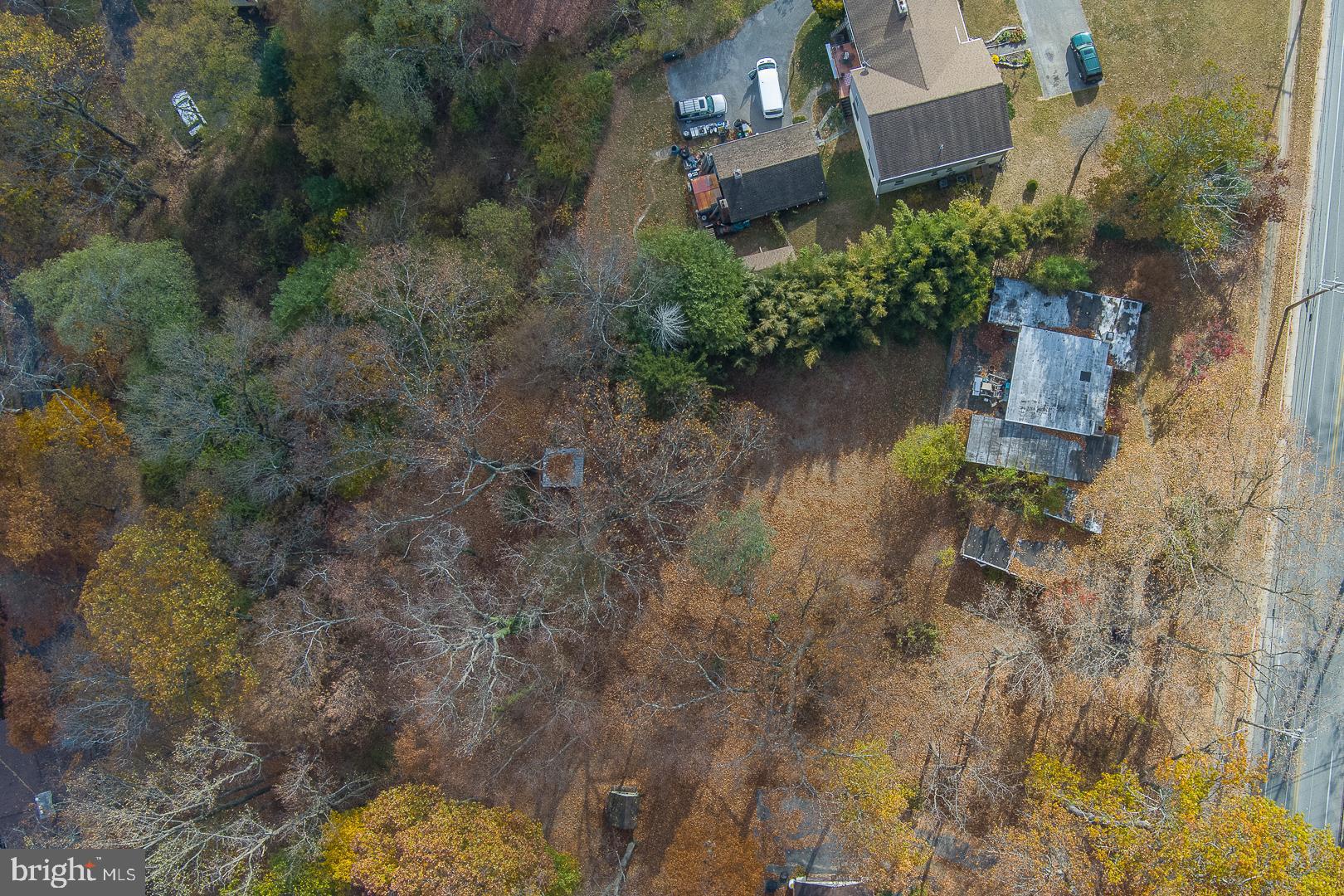 an aerial view of house with yard swimming pool and outdoor seating