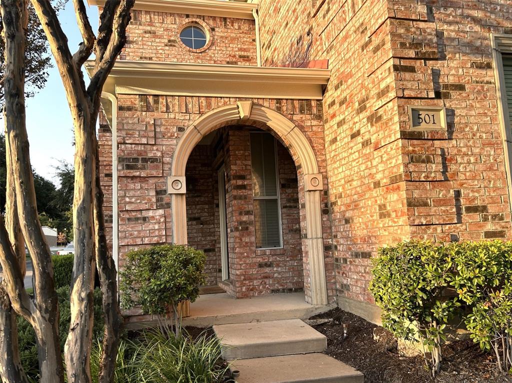 a view of a building with a garden