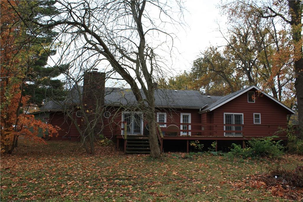 a view of house with a yard