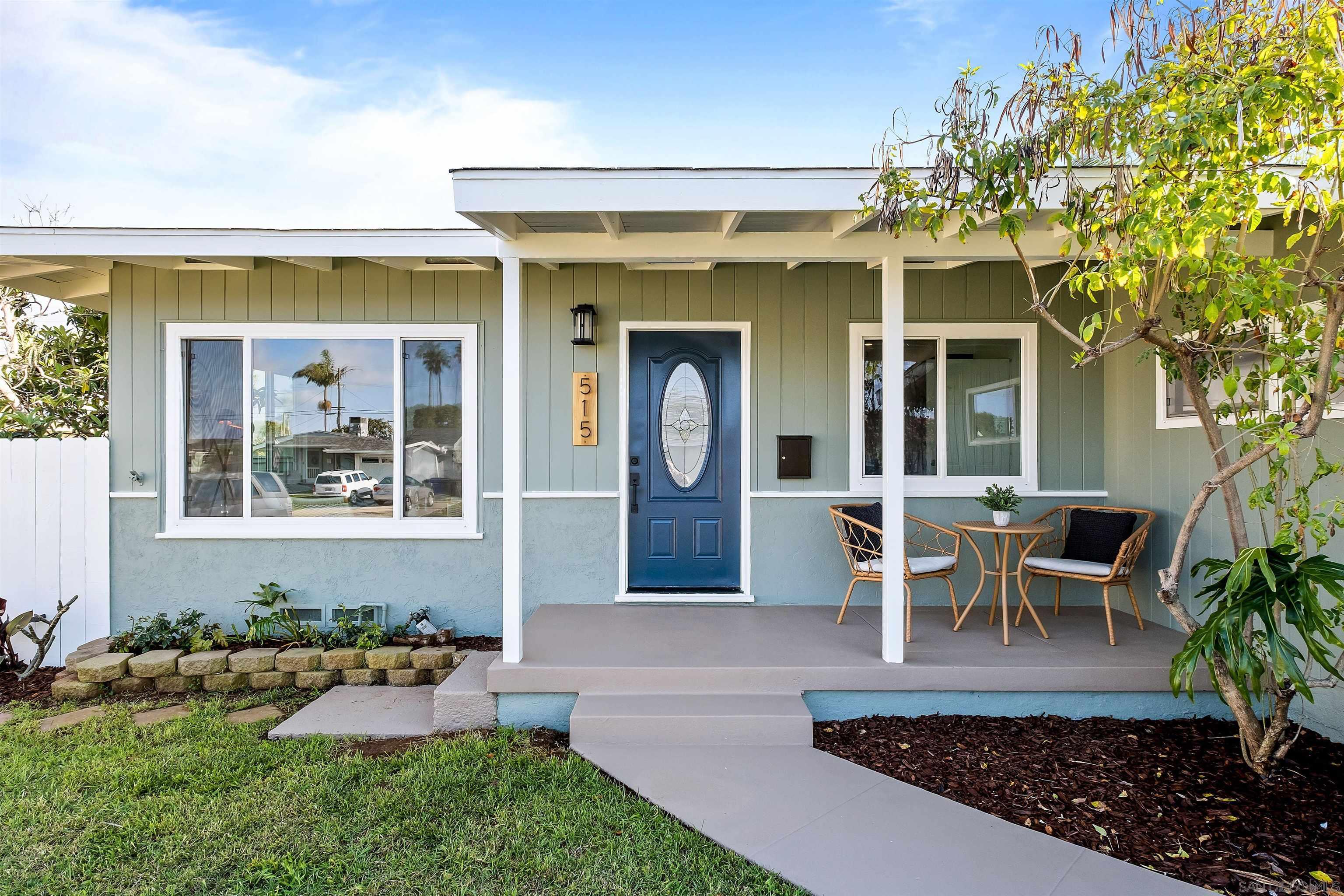 a view of a house with patio outdoor seating