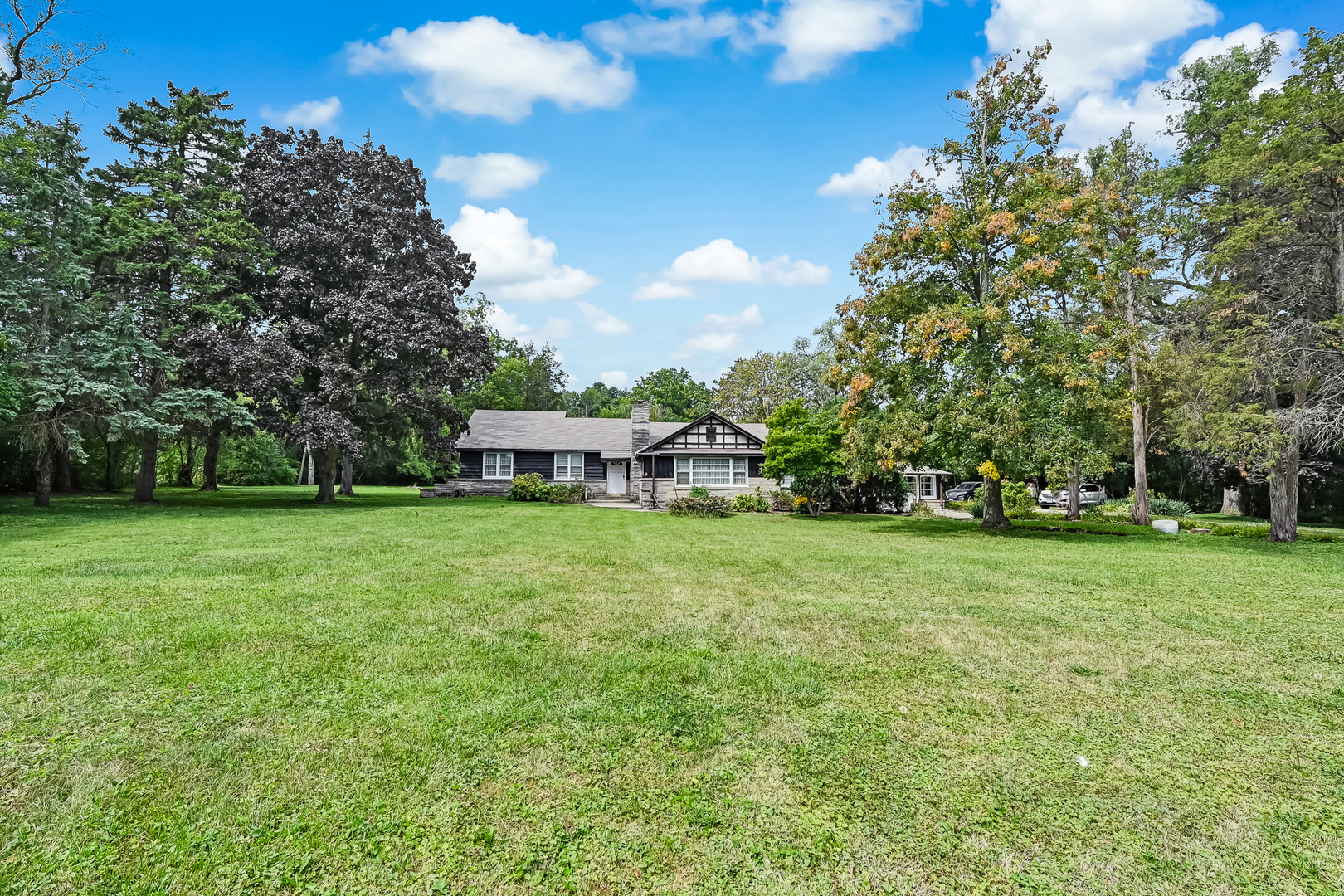 a view of a house with a big yard