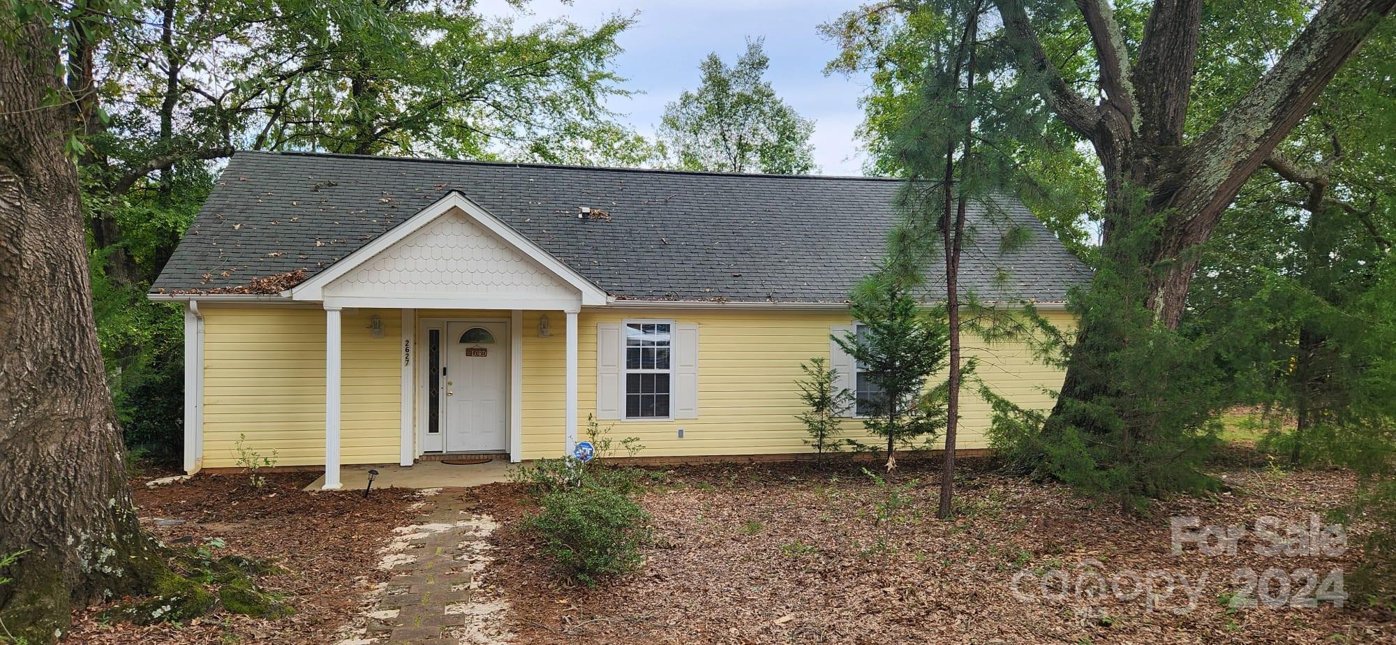 front view of a house with a yard