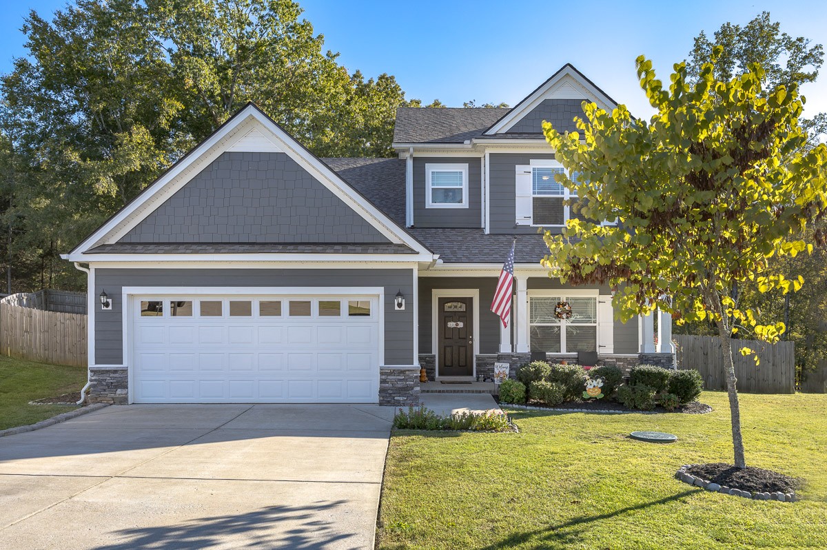 a front view of a house with a yard