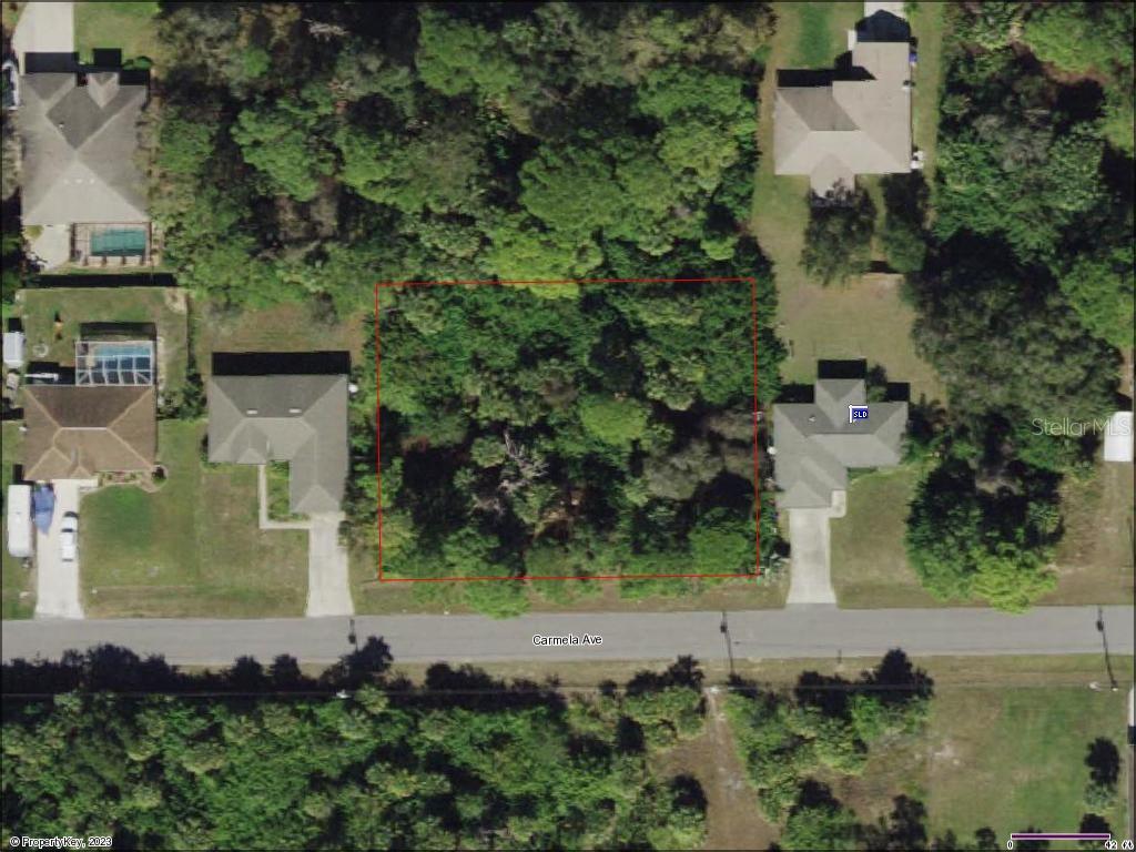 an aerial view of a house with a garden