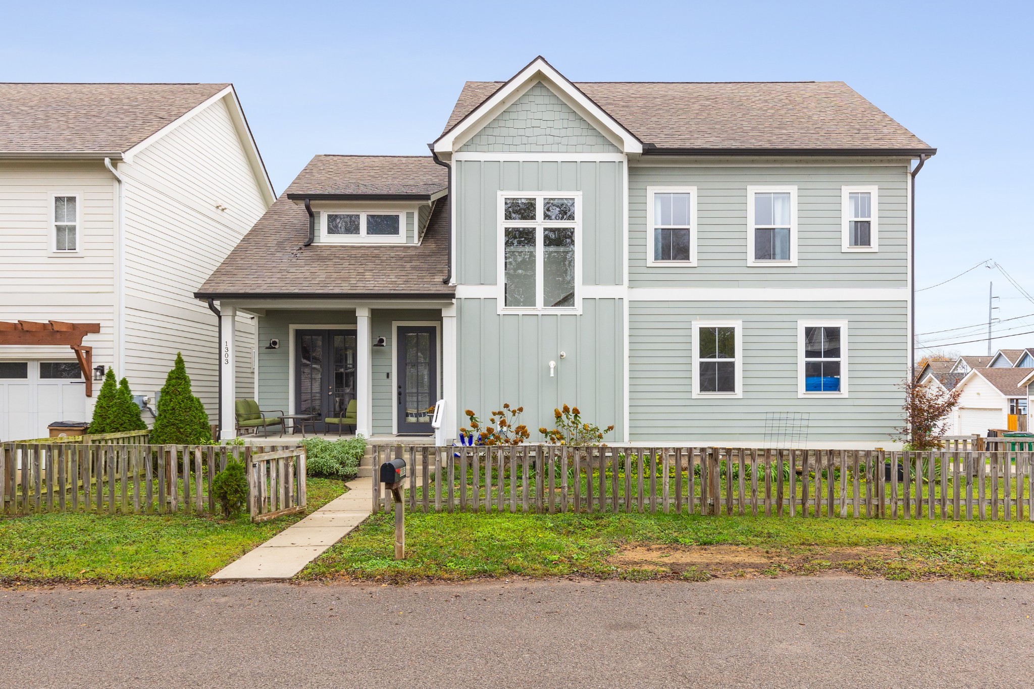 a front view of a house with a yard and porch