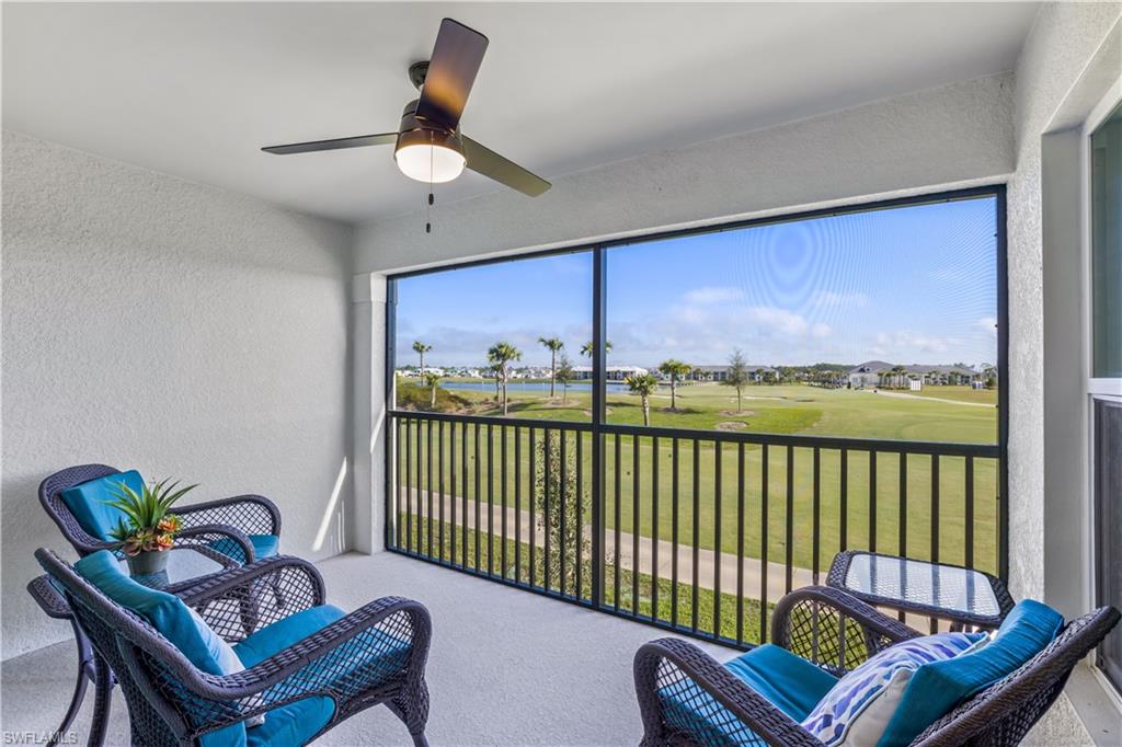 a view of a balcony with furniture