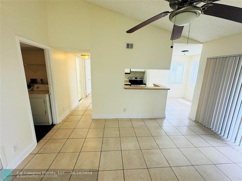 a kitchen with a sink a stove and refrigerator