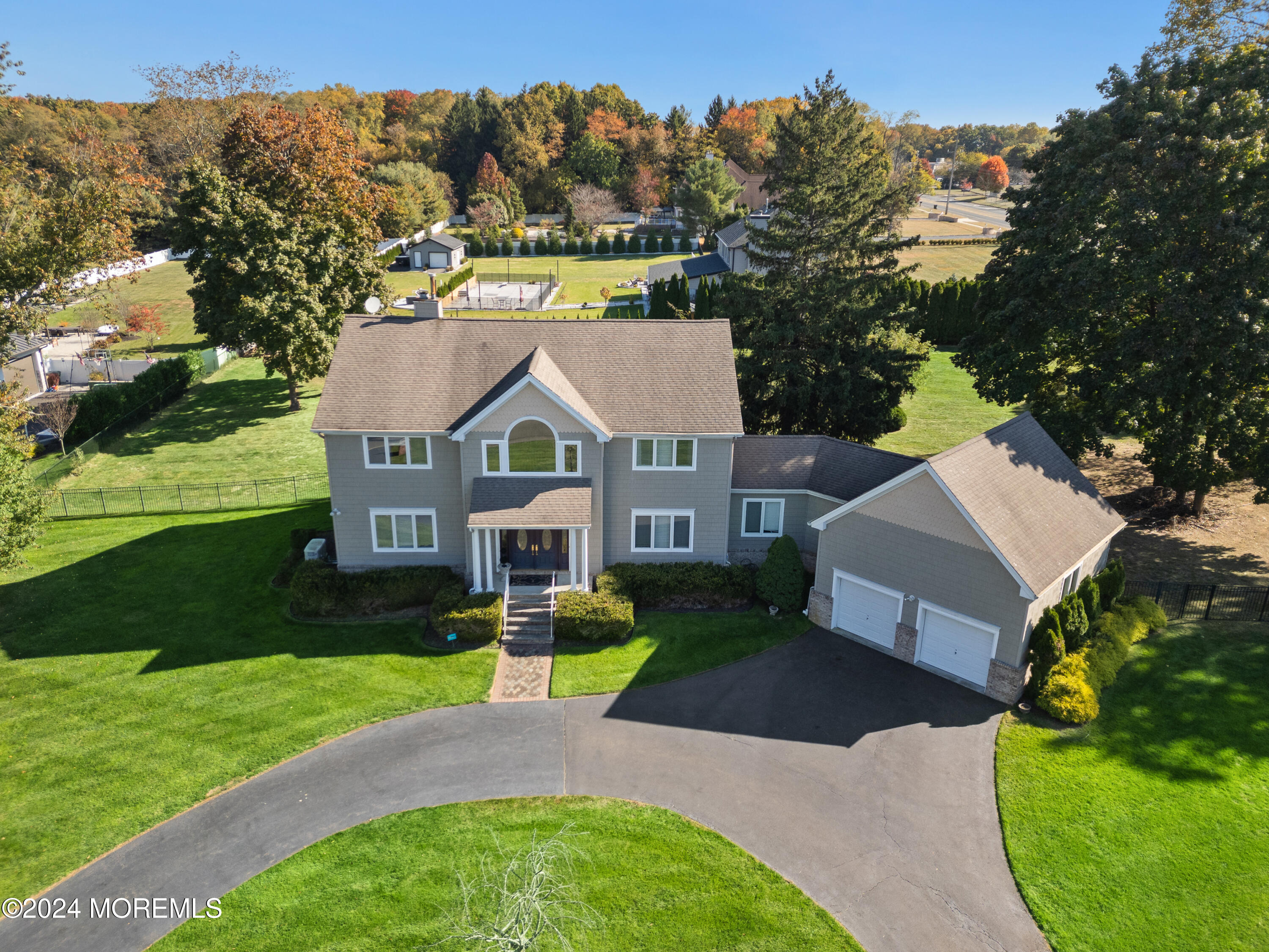 a aerial view of a house with garden and trees