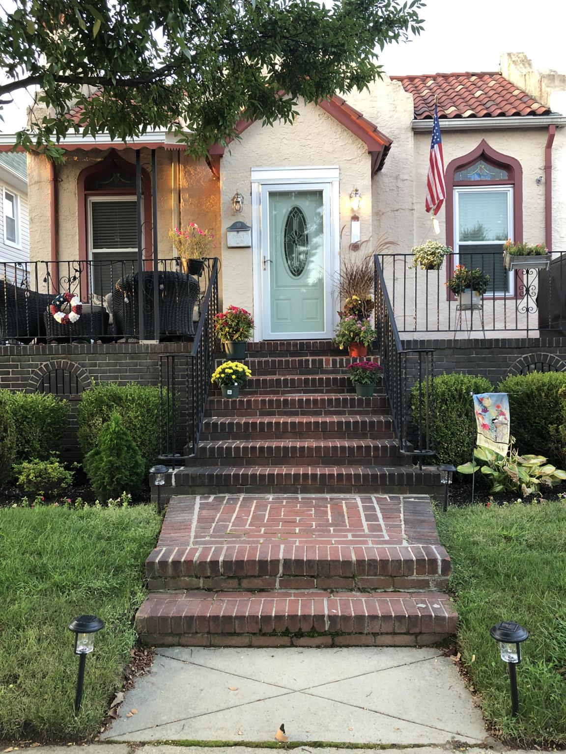 a front view of a house with garden