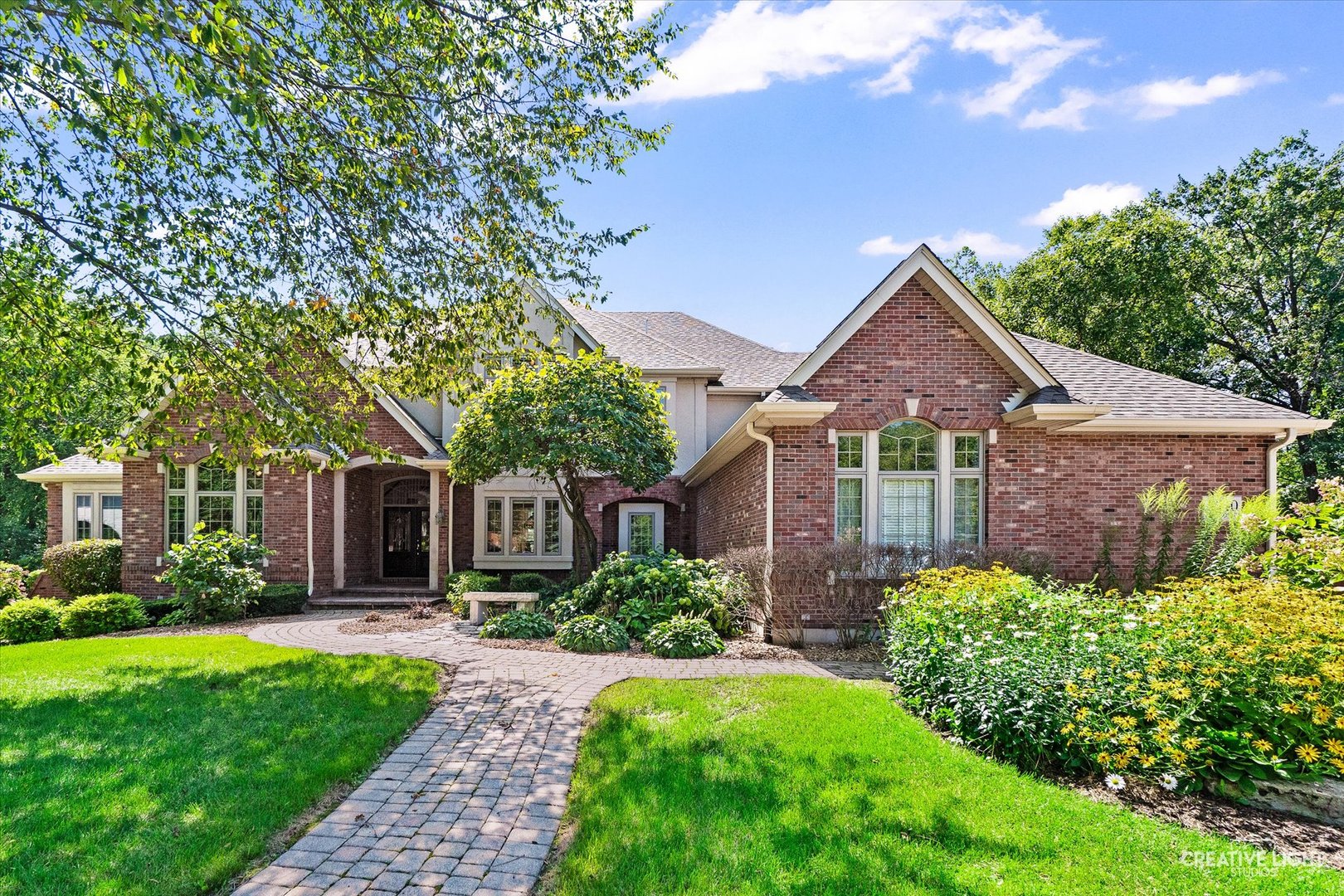 front view of a house with a yard