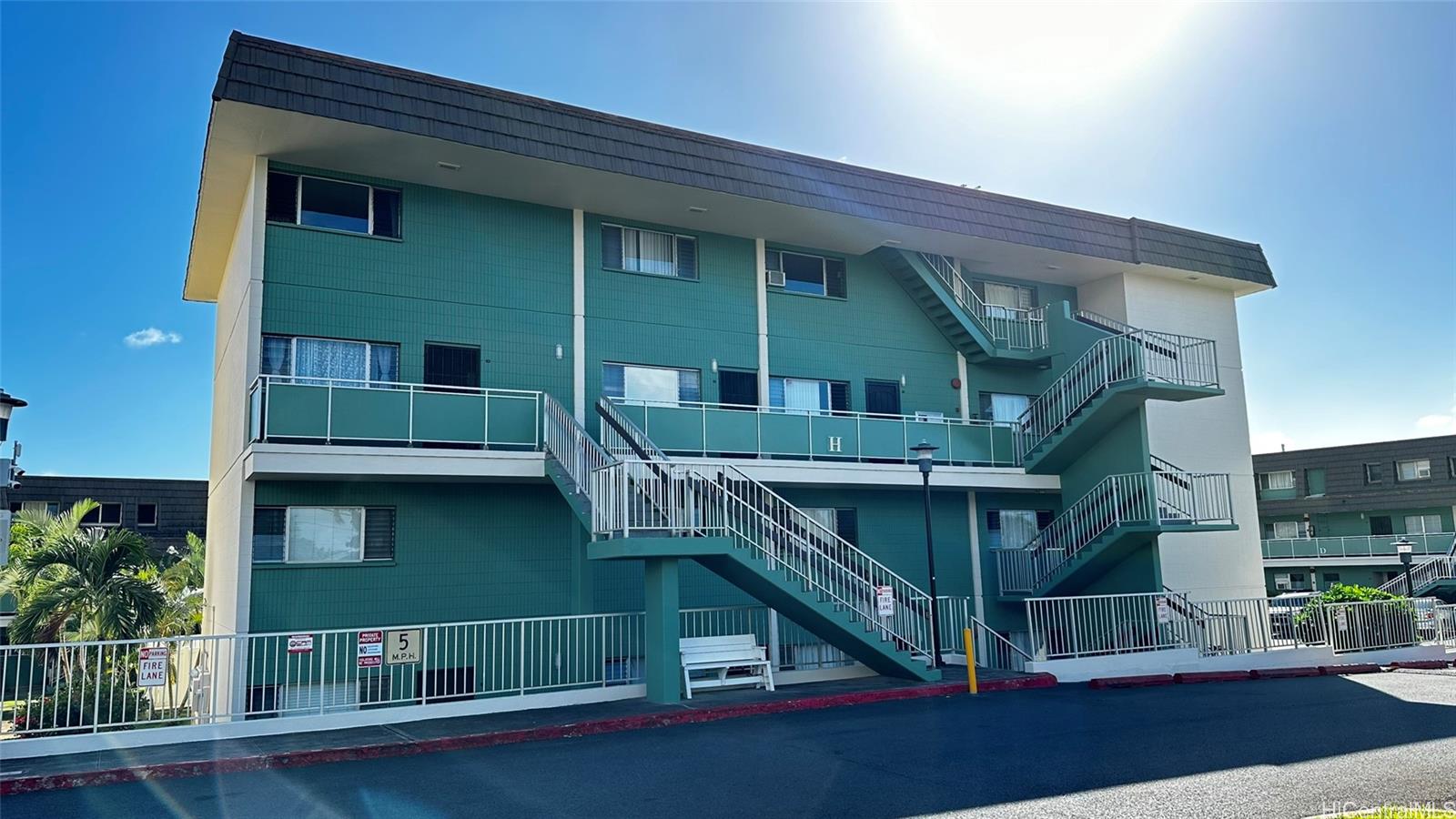 a view of house with outdoor space and balcony