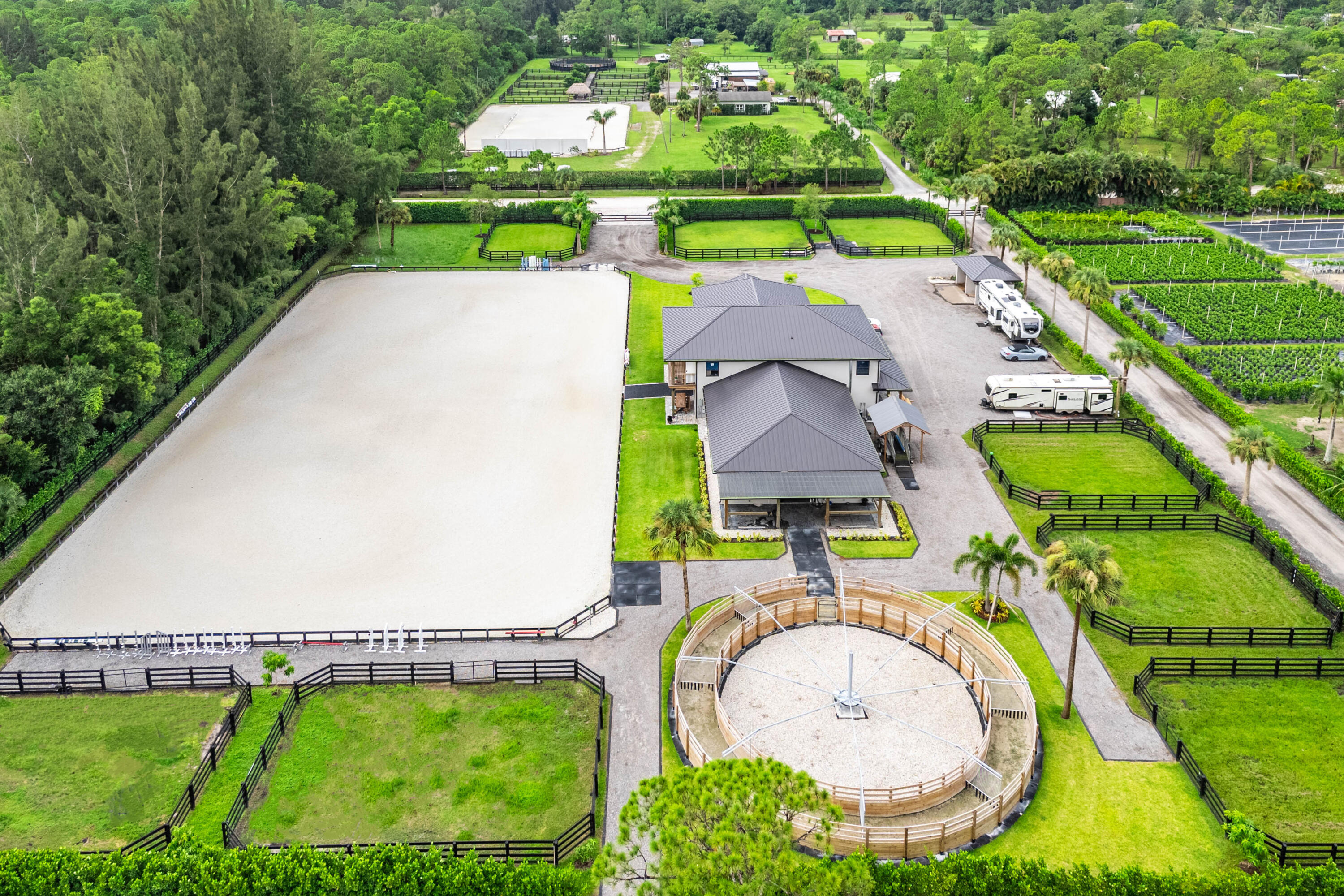 an aerial view of a house with a swimming pool