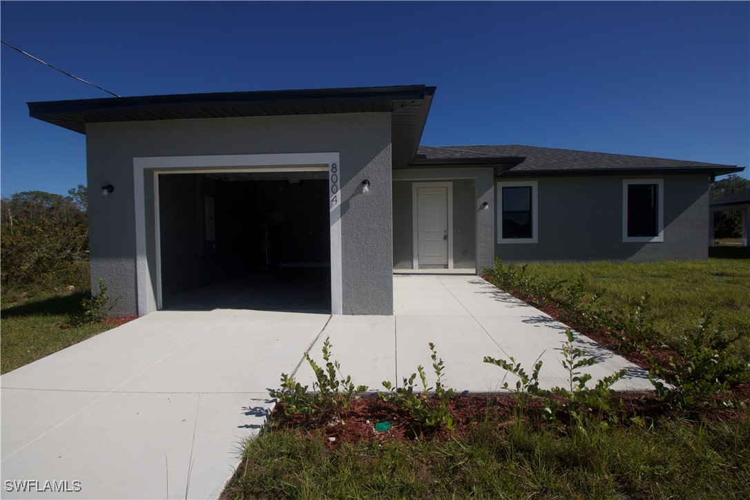 a house with yard in front of it