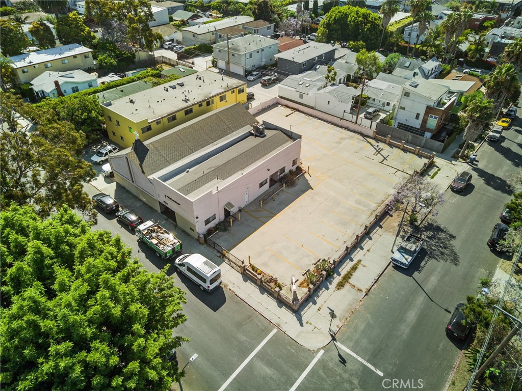 an aerial view of a residential building with an outdoor space